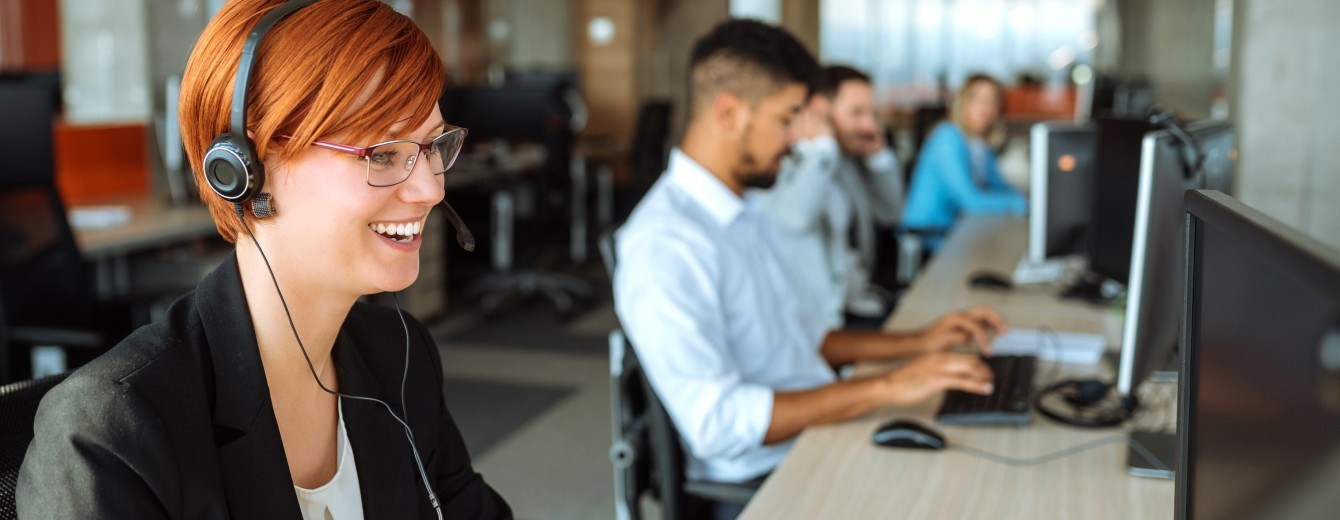 Support helpdesk workers taking customer calls