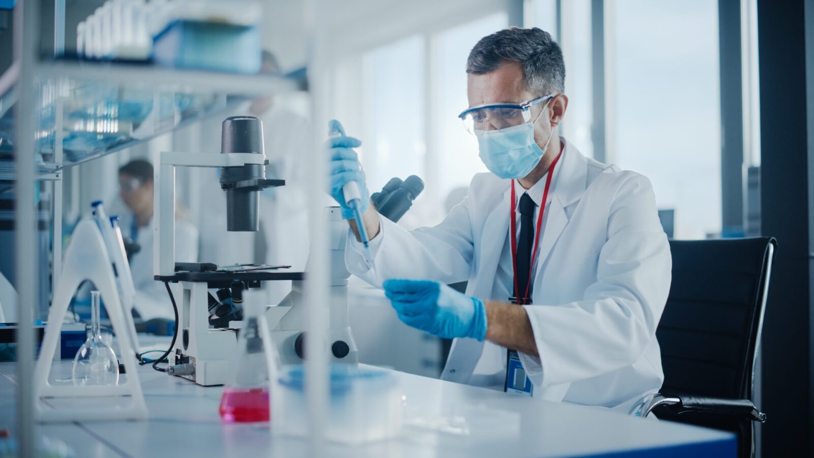 Pharmaceutical laboratory worker running a test